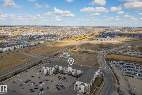 Expansive aerial perspective showcasing a multi-story residential building with gabled roofs and balconies - 1306 330 Clareview Station Drive, Edmonton, AB - Outdoor With View