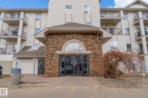Building exterior featuring stone veneer accents and multiple balconies - 1306 330 Clareview Station Drive, Edmonton, AB - Outdoor
