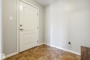 Entryway featuring a white paneled door with brushed nickel hardware, light gray walls, and ceramic tile flooring - 1306 330 Clareview Station Drive, Edmonton, AB  - Indoor Photo Showing Other Room 