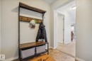 Entryway featuring light neutral wall paint, wood-finish flooring, and white baseboards - 1306 330 Clareview Station Drive, Edmonton, AB  - Indoor Photo Showing Other Room 
