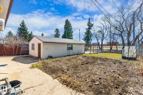 Detached garage with stucco exterior and shingle roof - 10531 128 Avenue, Edmonton, AB - Outdoor