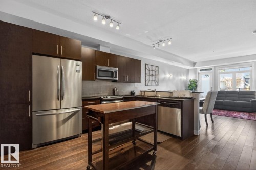 Hardwood Floors & Stainless Steel Appliances - 102 10811 72 Avenue, Edmonton, AB - Indoor Photo Showing Kitchen With Stainless Steel Kitchen
