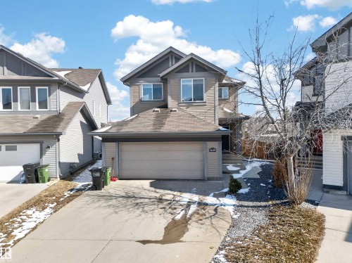 Two-story residence featuring light-toned siding and dark trim accents - 3639 15A Street, Edmonton, AB - Outdoor With Facade
