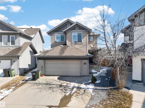 Modern two-story residence with attached garage, featuring horizontal siding and contrasting trim - 3639 15A Street, Edmonton, AB - Outdoor With Facade