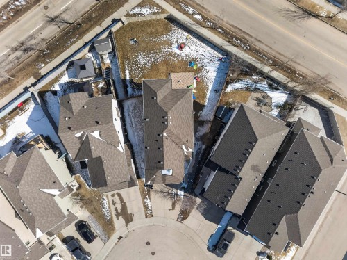 Aerial perspective showcasing a residential property with a shingled roof and a private backyard - 3639 15A Street, Edmonton, AB - Outdoor With View