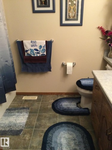 Bathroom featuring neutral wall paint and tile flooring - 123064 Hwy 45, Rural Two Hills County, AB 
