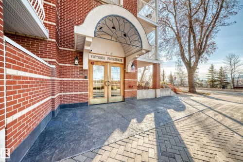 View of exterior entry with french doors and brick siding - 507 11716 100 Avenue, Edmonton, AB - Outdoor