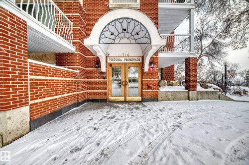 Snow covered property entrance featuring french doors - 507 11716 100 Avenue, Edmonton, AB - Outdoor
