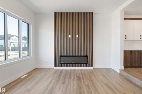 203 Basin Court, Leduc, AB - Indoor Photo Showing Other Room With Fireplace