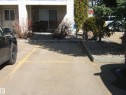 Ground-level patio with sliding glass door access - 105 11214 80 Street, Edmonton, AB  - Outdoor 