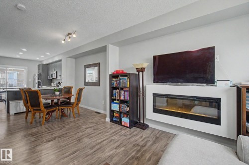 85 2803 James Mowatt Trail, Edmonton, AB - Indoor Photo Showing Living Room With Fireplace