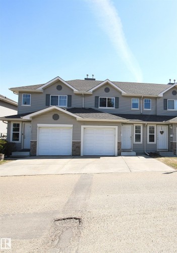 Contemporary multi-unit dwelling with light gray siding and white trim - 11 230 Edwards Drive, Edmonton, AB - Outdoor With Facade