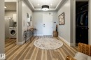 Entryway featuring wood-finish flooring, recessed lighting, and a contemporary ceiling fixture - 108 7463 May Common, Edmonton, AB  - Indoor 