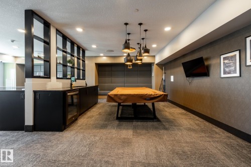 Recreation room featuring a pool table, modern pendant lighting, and recessed ceiling lights - 108 7463 May Common, Edmonton, AB - Indoor Photo Showing Other Room