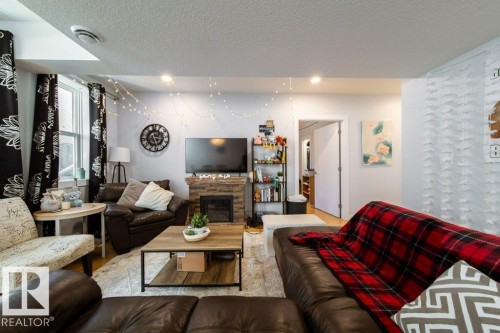 8731 85 Avenue, Edmonton, AB - Indoor Photo Showing Living Room With Fireplace