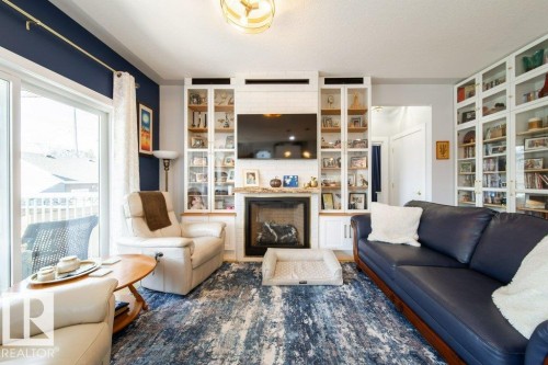 8731 85 Avenue, Edmonton, AB - Indoor Photo Showing Living Room With Fireplace