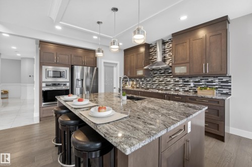 With large 8x5 feet Island and gas stove. - 1468 Enright Landing, Edmonton, AB - Indoor Photo Showing Kitchen With Upgraded Kitchen