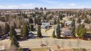 Aerial perspective showcasing a residential neighborhood with numerous mature trees - 394 Walker Road, Edmonton, AB  - Outdoor With View 