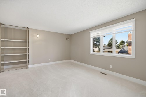 Light-filled room featuring neutral wall tones, white trim, and plush carpeting - 394 Walker Road, Edmonton, AB - Indoor Photo Showing Other Room