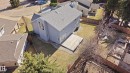 Gray-sided residence with a light gray shingle roof, featuring multiple skylights - 394 Walker Road, Edmonton, AB  - Outdoor 