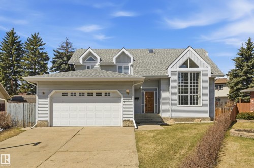 Two-story residence featuring light gray siding and a gray shingled roof - 394 Walker Road, Edmonton, AB - Outdoor
