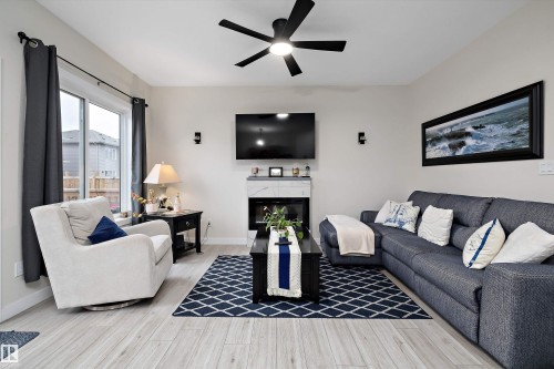 Open living area featuring light wood-finish flooring - 82 Wingate Way, Fort Saskatchewan, AB - Indoor Photo Showing Living Room