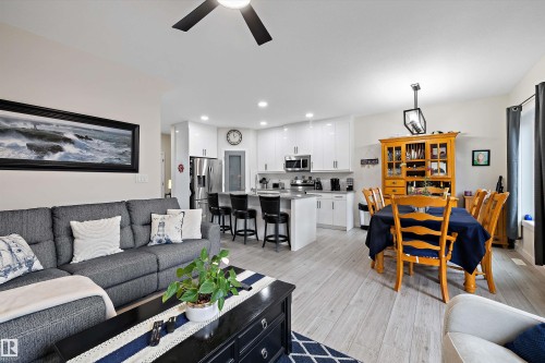 Open-concept living space featuring wood-finish flooring throughout - 82 Wingate Way, Fort Saskatchewan, AB - Indoor Photo Showing Living Room