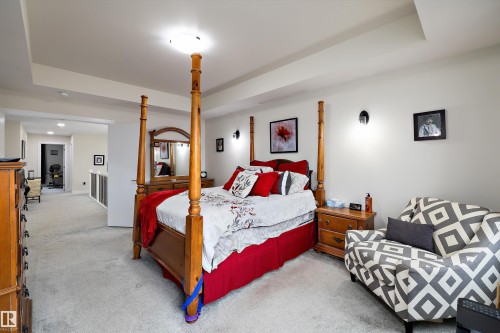 Spacious room featuring tray ceilings, neutral carpeting, and recessed lighting - 82 Wingate Way, Fort Saskatchewan, AB - Indoor Photo Showing Bedroom