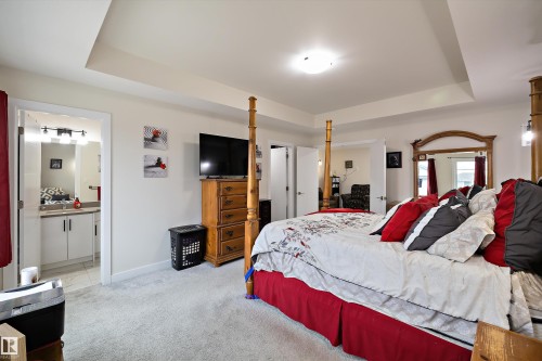 Recessed tray ceiling over carpeted flooring - 82 Wingate Way, Fort Saskatchewan, AB - Indoor Photo Showing Bedroom