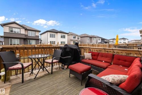 Expansive outdoor deck featuring wood flooring and a perimeter wood fence - 82 Wingate Way, Fort Saskatchewan, AB - Outdoor With Exterior