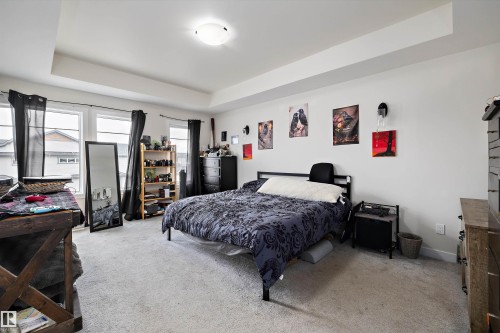 Recessed tray ceiling with central flush-mount light fixture - 84 Wingate Way, Fort Saskatchewan, AB 