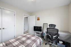 Neutral-toned room featuring a single door opening, a pair of bi-fold doors, and recessed ceiling lighting - 