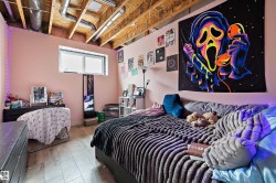 Room featuring exposed ceiling joists, light wood-finish flooring, and a single window - 