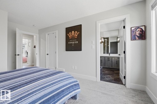 Light gray walls complementing white trim - 61 230 Edgemont Road, Edmonton, AB - Indoor Photo Showing Bedroom