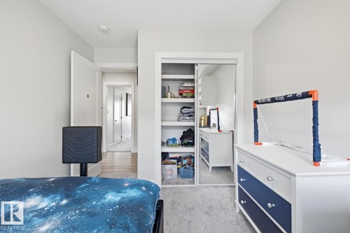 Soft gray walls complement light gray carpeting - 61 230 Edgemont Road, Edmonton, AB - Indoor Photo Showing Bedroom