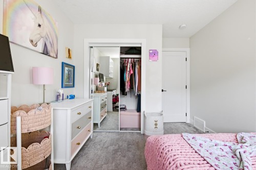Bedroom featuring light gray walls and gray carpeting - 61 230 Edgemont Road, Edmonton, AB - Indoor Photo Showing Bedroom