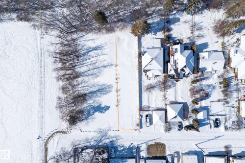 An aerial view of the property, outlined in orange, showcasing its generous dimensions - 9209 96 Street Nw, Edmonton, AB 