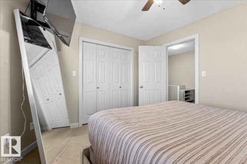 Bedroom featuring neutral wall tones, carpeted flooring, and a ceiling fan with integrated lighting - 18 6032 38 Avenue, Edmonton, AB - Indoor Photo Showing Bedroom