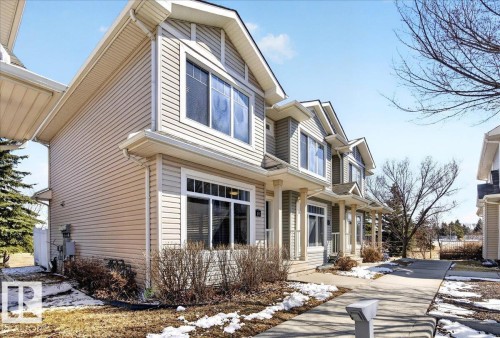 Townhome exterior featuring horizontal siding and gabled rooflines - 18 6032 38 Avenue, Edmonton, AB - Outdoor