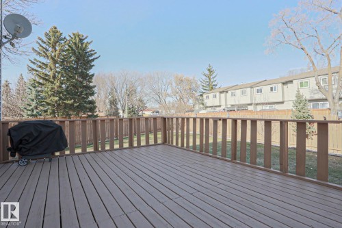 Spacious wood-finish deck with a perimeter railing - 2433 89 Street, Edmonton, AB - Outdoor With Deck Patio Veranda