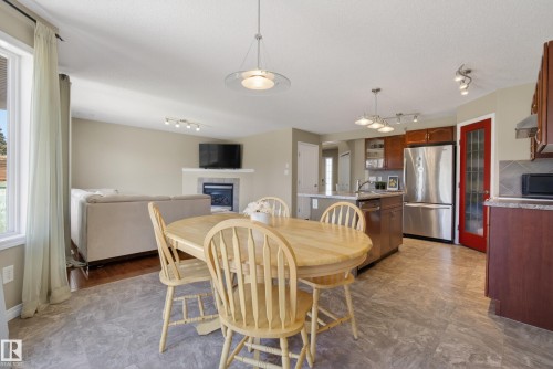 9144 207 Street, Edmonton, AB - Indoor Photo Showing Dining Room With Fireplace
