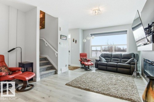 8018 Kiriak Link, Edmonton, AB - Indoor Photo Showing Living Room With Fireplace