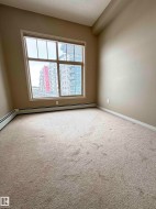 Windowed room featuring wall-to-wall carpeting and baseboard heating - 
