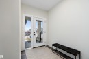 Entryway featuring a full-light door with a sidelight, dark wood-finish flooring, and light wall paint - 591 Boulder Wynd, Leduc, AB  - Indoor Photo Showing Other Room 