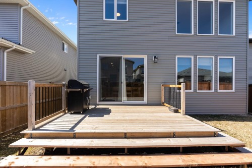 Spacious wood deck with multi-level steps and partial wood railing - 591 Boulder Wynd, Leduc, AB - Outdoor With Deck Patio Veranda With Exterior