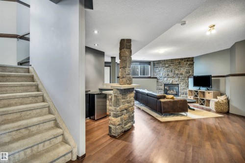 4 Birchmont Drive, Leduc, AB - Indoor Photo Showing Other Room With Fireplace