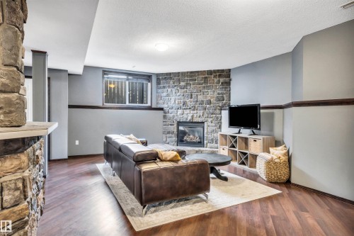 4 Birchmont Drive, Leduc, AB - Indoor Photo Showing Other Room With Fireplace