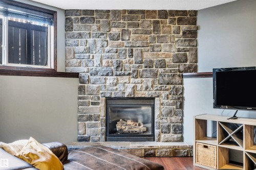 4 Birchmont Drive, Leduc, AB - Indoor Photo Showing Living Room With Fireplace