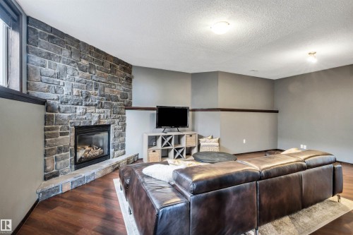 4 Birchmont Drive, Leduc, AB - Indoor Photo Showing Living Room With Fireplace
