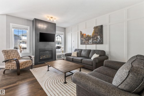 3087 Carpenter Landing, Edmonton, AB - Indoor Photo Showing Living Room With Fireplace